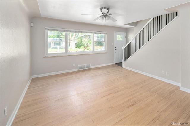 1856 S Monroe St, Denver, CO 80210 - unfurnished living room with stairway, ceiling fan, and wood finished floors