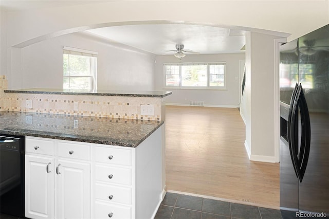 1856 S Monroe St, Denver, CO 80210 - kitchen featuring refrigerator with ice dispenser, dishwasher, a ceiling fan, decorative backsplash, and white cabinetry