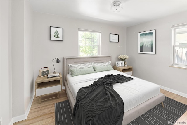 1856 S Monroe St, Denver, CO 80210 - bedroom with light wood finished floors