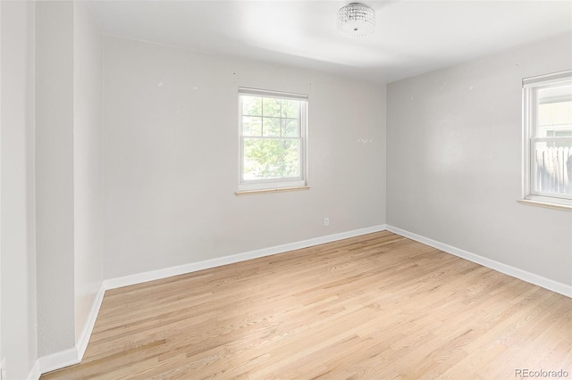 1856 S Monroe St, Denver, CO 80210 - empty room featuring light wood finished floors and baseboards