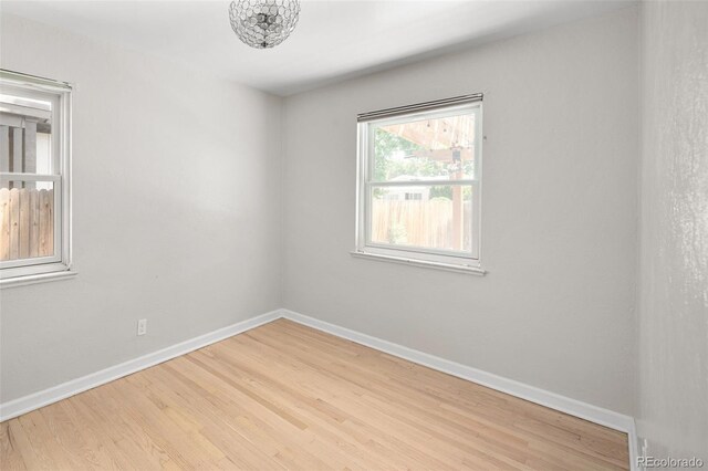 1856 S Monroe St, Denver, CO 80210 - empty room featuring baseboards and wood finished floors