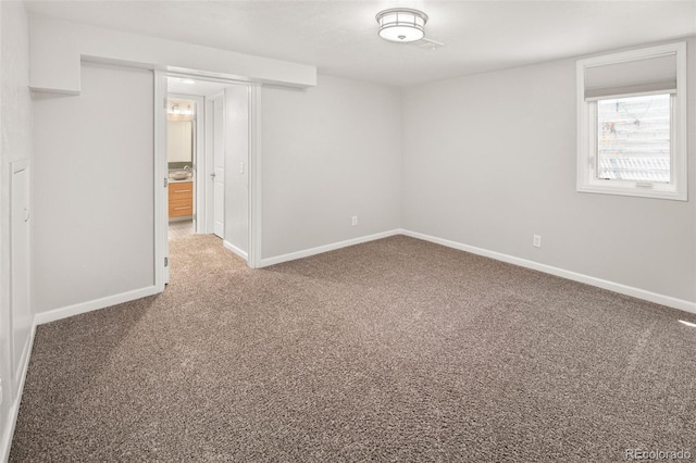 1856 S Monroe St, Denver, CO 80210 - empty room featuring carpet floors and baseboards