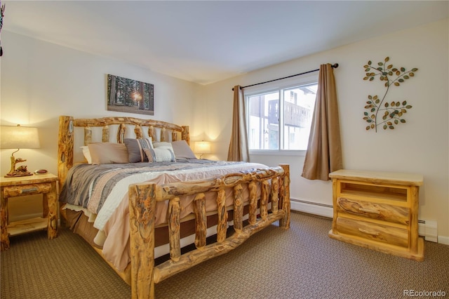 carpeted bedroom with baseboard heating