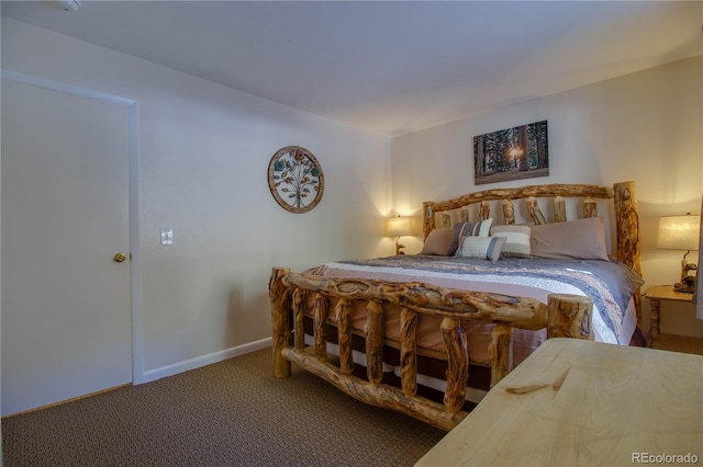 bedroom featuring carpet floors and baseboards