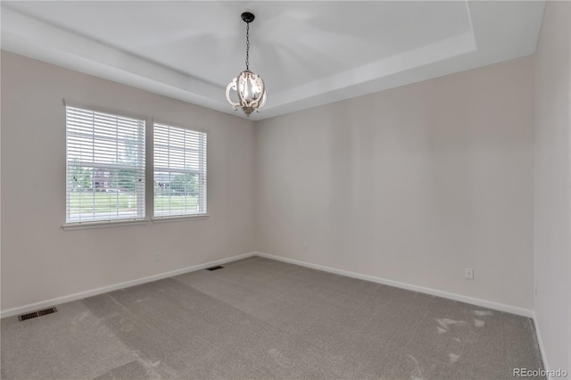 3678 Shadow Cir, Castle Rock, CO 80109 - carpeted empty room featuring a raised ceiling and a chandelier