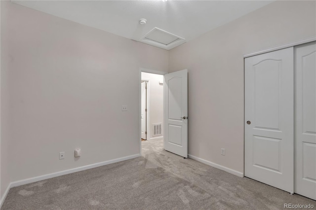 3678 Shadow Cir, Castle Rock, CO 80109 - unfurnished bedroom with light colored carpet, attic access, and a closet