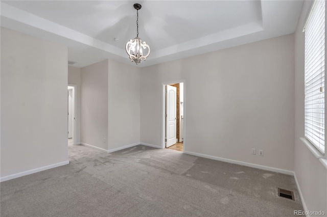 3678 Shadow Cir, Castle Rock, CO 80109 - empty room with a raised ceiling, a chandelier, and carpet