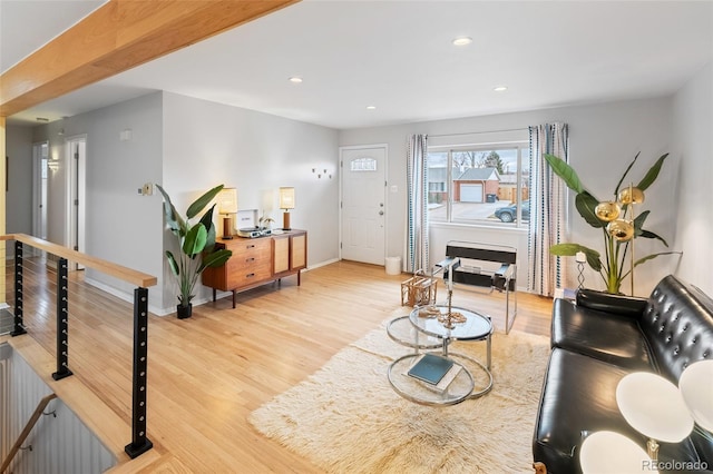 living room with light hardwood / wood-style flooring