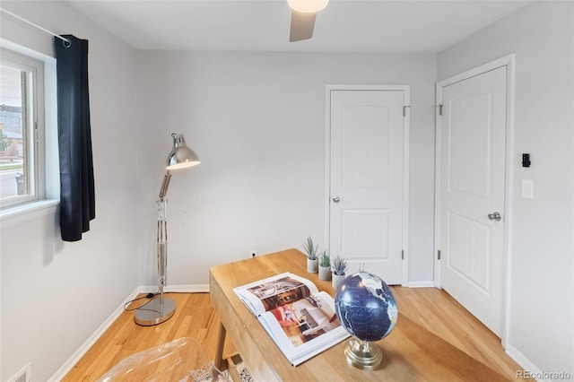 office space with hardwood / wood-style floors and ceiling fan