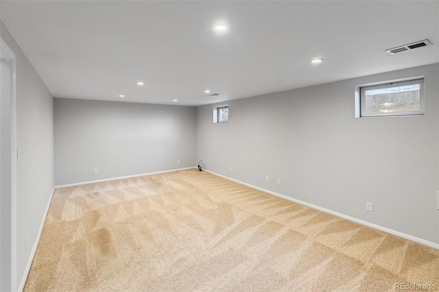 basement with light colored carpet