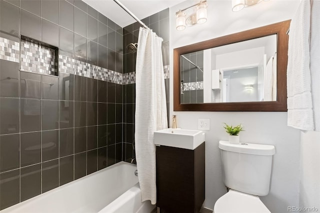 full bathroom featuring shower / bath combination with curtain, vanity, and toilet