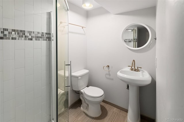 bathroom with toilet and walk in shower