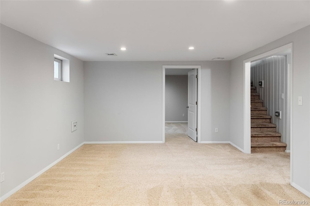 basement with light colored carpet