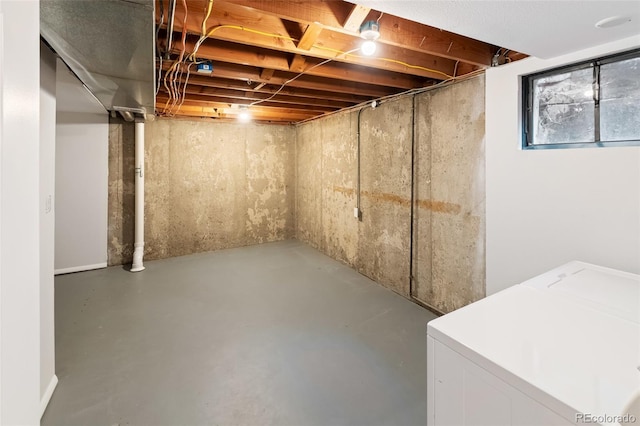 basement featuring washing machine and clothes dryer