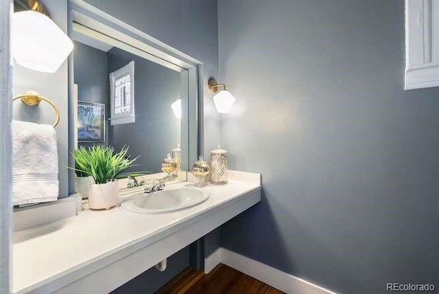 bathroom featuring hardwood / wood-style floors and sink