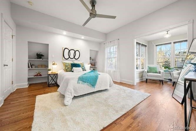 bedroom featuring hardwood / wood-style floors and ceiling fan