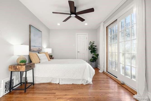 bedroom with hardwood / wood-style flooring and ceiling fan