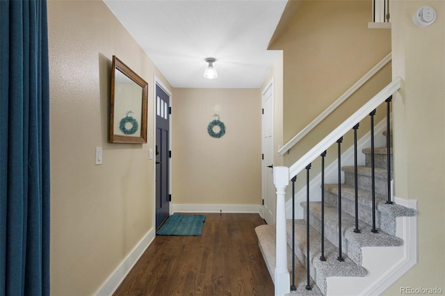 23 Honey Locust, Littleton, CO 80127 - foyer featuring dark wood-style floors and stairs