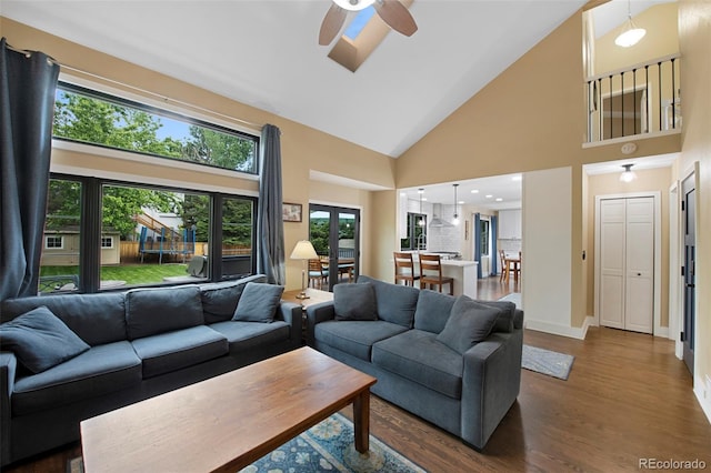 23 Honey Locust, Littleton, CO 80127 - living area with a ceiling fan, high vaulted ceiling, and dark wood-style flooring