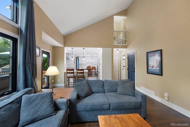 23 Honey Locust, Littleton, CO 80127 - living room with high vaulted ceiling and wood finished floors