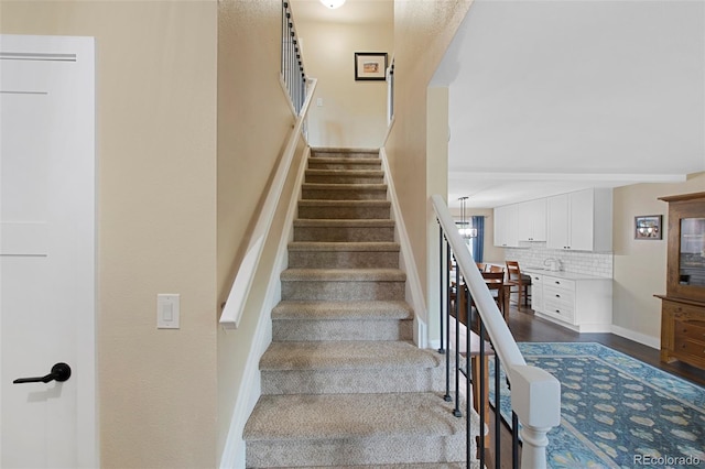 23 Honey Locust, Littleton, CO 80127 - stairway featuring baseboards