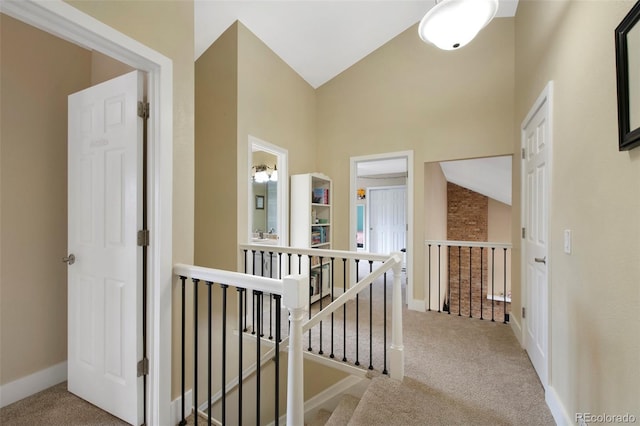 23 Honey Locust, Littleton, CO 80127 - hallway featuring carpet flooring, an upstairs landing, and high vaulted ceiling