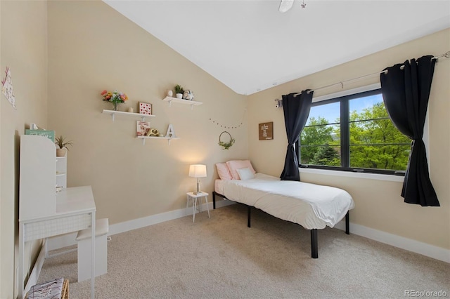 23 Honey Locust, Littleton, CO 80127 - carpeted bedroom featuring vaulted ceiling and baseboards