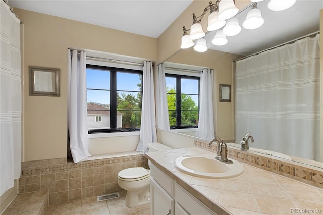 23 Honey Locust, Littleton, CO 80127 - full bath featuring vanity, tile patterned floors, and curtained shower