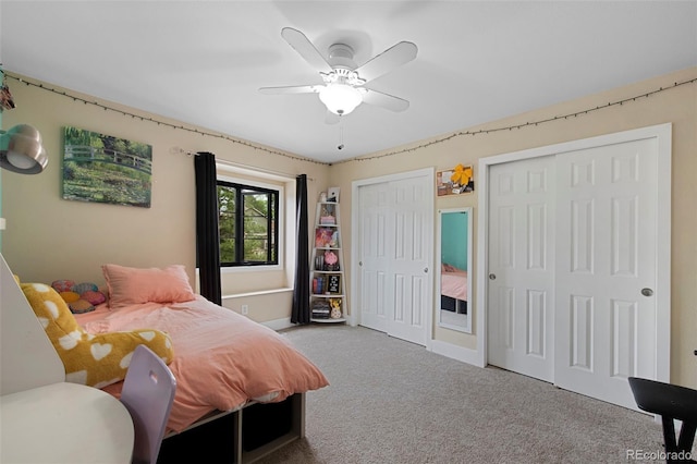 23 Honey Locust, Littleton, CO 80127 - bedroom featuring carpet floors, two closets, and ceiling fan