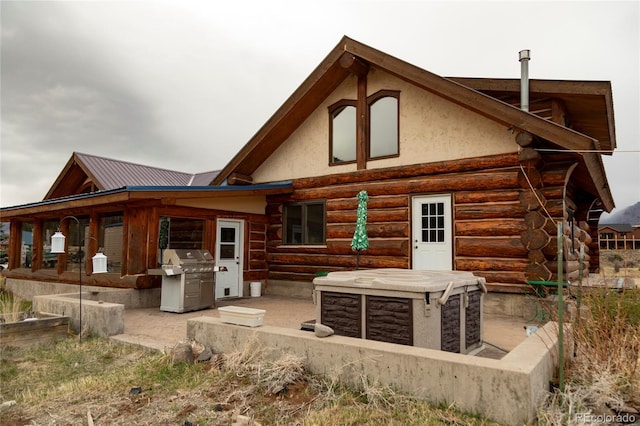 back of property with log siding