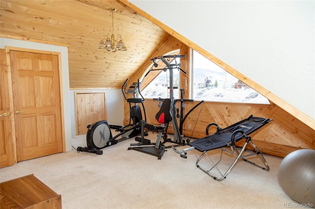 workout area with wooden walls, carpet floors, vaulted ceiling, and a chandelier