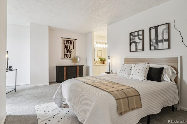 bedroom with carpet, baseboards, a chandelier, and a textured ceiling