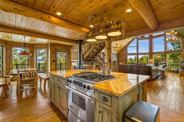 32806 Lakeside Dr, Buena Vista, CO 81211 - kitchen featuring high end range, hardwood / wood-style flooring, a chandelier, plenty of natural light, and a wood ceiling with exposed beams