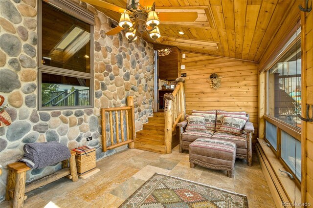 32806 Lakeside Dr, Buena Vista, CO 81211 - sitting room with lofted ceiling, wooden ceiling, a baseboard radiator, stone finish floors, and ceiling fan