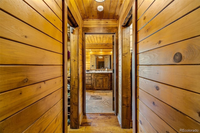 32806 Lakeside Dr, Buena Vista, CO 81211 - hall featuring wooden walls, wooden ceiling, and light wood-type flooring