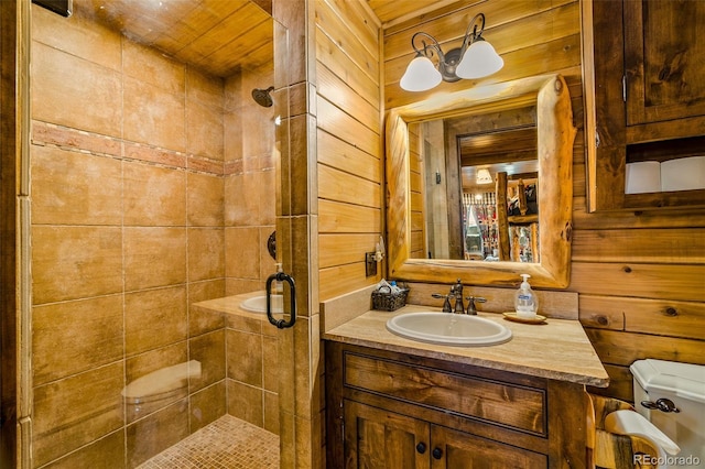 32806 Lakeside Dr, Buena Vista, CO 81211 - bathroom with a shower stall, vanity, and wooden walls