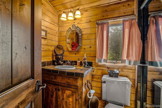 32806 Lakeside Dr, Buena Vista, CO 81211 - bathroom featuring vanity, wooden walls, and lofted ceiling
