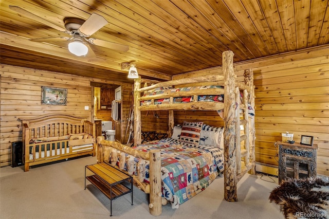32806 Lakeside Dr, Buena Vista, CO 81211 - bedroom with carpet floors, wooden ceiling, wood walls, a baseboard radiator, and a ceiling fan