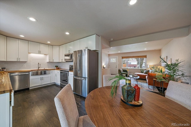 6026 Iris Way, Arvada, CO 80004 - interior space with dark wood-style floors and recessed lighting