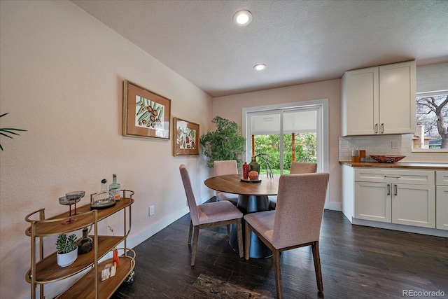 6026 Iris Way, Arvada, CO 80004 - dining area with baseboards, dark wood-type flooring, and a healthy amount of sunlight