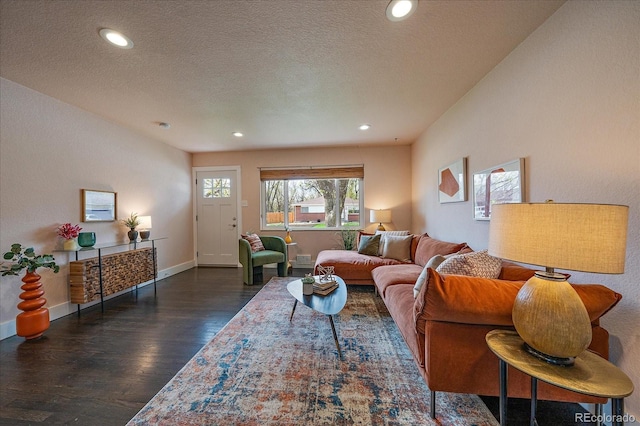 6026 Iris Way, Arvada, CO 80004 - living room featuring dark wood-style flooring, a textured ceiling, and recessed lighting