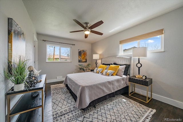 6026 Iris Way, Arvada, CO 80004 - bedroom featuring ceiling fan, wood finished floors, baseboards, and multiple windows