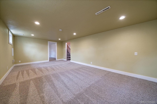 6026 Iris Way, Arvada, CO 80004 - unfurnished room featuring recessed lighting, baseboards, visible vents, stairway, and light colored carpet