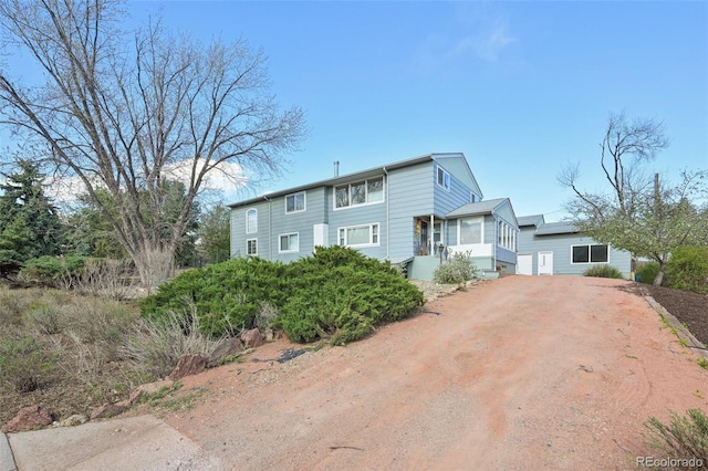 1055 N 18th St, Colorado Springs, CO 80904 - colonial-style house with dirt driveway