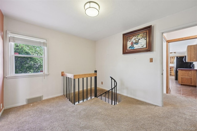 1055 N 18th St, Colorado Springs, CO 80904 - staircase with visible vents, carpet, and baseboards