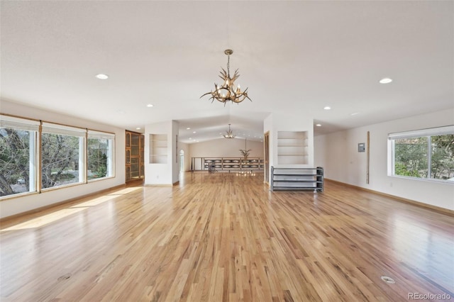 1055 N 18th St, Colorado Springs, CO 80904 - unfurnished living room featuring an inviting chandelier, recessed lighting, light wood-style flooring, and baseboards