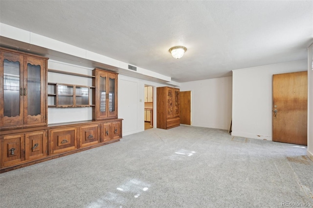 1055 N 18th St, Colorado Springs, CO 80904 - unfurnished living room with carpet floors and visible vents