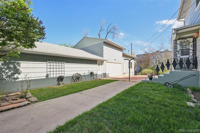 1055 N 18th St, Colorado Springs, CO 80904 - view of property exterior with a yard and a garage