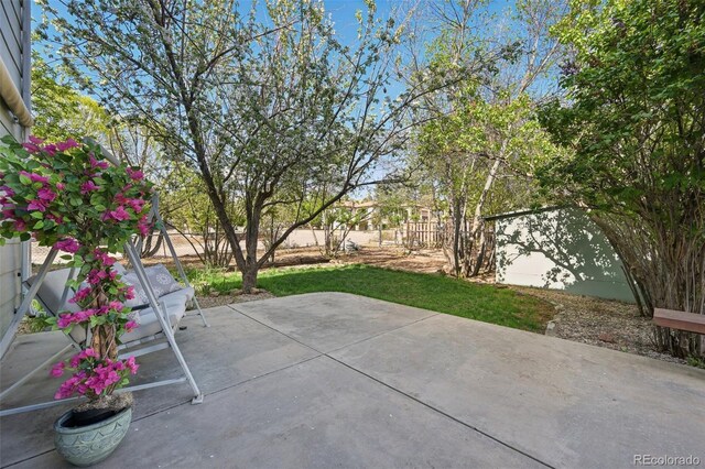 1055 N 18th St, Colorado Springs, CO 80904 - view of patio with a fenced backyard