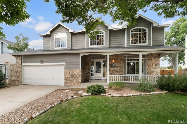 5649 W 109th Cir, Westminster, CO 80020 - traditional-style house featuring a porch, stone siding, and concrete driveway